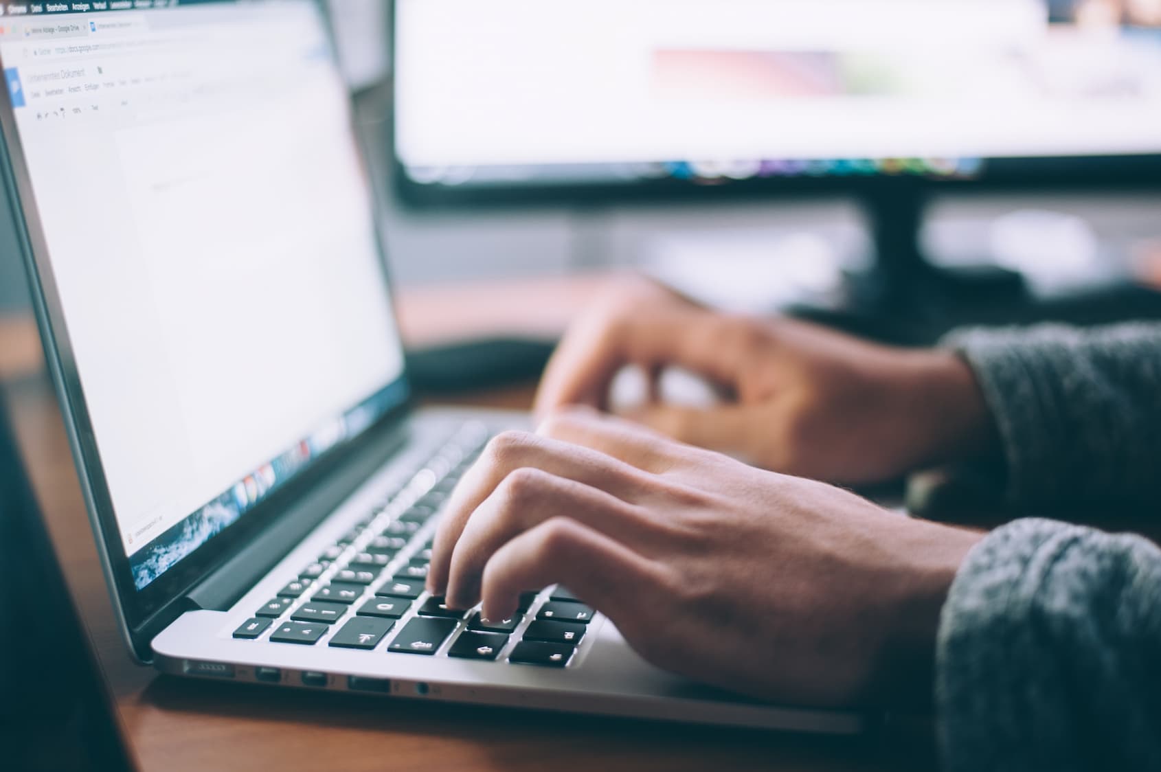 Person using laptop to find out more information about Smart Nation